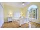 Bright bedroom with hardwood floors, a large window, and white furniture at 44 Hamby Dr., Pawleys Island, SC 29585