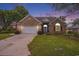 Charming brick home with well-manicured lawn, mature trees, and welcoming curb appeal at 44 Hamby Dr., Pawleys Island, SC 29585