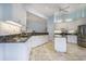 Bright kitchen featuring white cabinets, granite countertops, and stainless steel appliances at 44 Hamby Dr., Pawleys Island, SC 29585