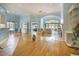 Bright living room with hardwood floors, fireplace, archways, and neutral paint at 44 Hamby Dr., Pawleys Island, SC 29585