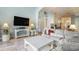 Inviting living room with fireplace, soft colors, and tile flooring at 44 Hamby Dr., Pawleys Island, SC 29585