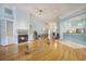 Spacious living room with fireplace, tile flooring, and soft blue walls at 44 Hamby Dr., Pawleys Island, SC 29585