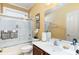 Cozy bathroom with a modern vanity, a bathtub, and a shower combo at 4608 Grovecrest Circle, North Myrtle Beach, SC 29582