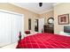Well-lit bedroom with a ceiling fan, a dresser, and a closet for ample storage at 4608 Grovecrest Circle, North Myrtle Beach, SC 29582