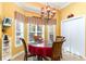 Cozy dining area with natural light and a charming chandelier at 4608 Grovecrest Circle, North Myrtle Beach, SC 29582