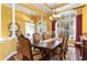 Elegant dining room featuring large windows and dark wood table with seating for six at 4608 Grovecrest Circle, North Myrtle Beach, SC 29582