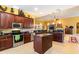 Spacious kitchen features granite countertops, stainless appliances, and a central island at 4608 Grovecrest Circle, North Myrtle Beach, SC 29582
