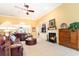 Comfortable living room with a fireplace, TV, and large leather sofa for relaxing at 4608 Grovecrest Circle, North Myrtle Beach, SC 29582
