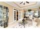 Living room with bright lighting, glass displays, and french doors at 4608 Grovecrest Circle, North Myrtle Beach, SC 29582