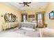 Elegant main bedroom with decorative tray ceiling and stylish furnishings at 4608 Grovecrest Circle, North Myrtle Beach, SC 29582
