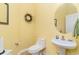 Bright powder room with a wall mirror, lighting fixtures, and tile flooring at 4608 Grovecrest Circle, North Myrtle Beach, SC 29582