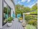 Balcony with outdoor seating, plants, and tranquil garden decor at 476 Lakeshore Dr., Pawleys Island, SC 29585