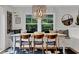 Charming dining area with modern lighting, a built-in bench, and stylish decor at 476 Lakeshore Dr., Pawleys Island, SC 29585