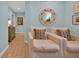 Inviting living room features tile floors, comfortable seating, and a decorative mirror enhancing the space at 476 Lakeshore Dr., Pawleys Island, SC 29585