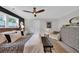 Bedroom with a ceiling fan, cozy seating, and a comfortable bed at 476 Lakeshore Dr., Pawleys Island, SC 29585
