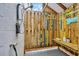 Fun outdoor shower with a wooden enclosure, a shower head, and colorful decorations at 476 Lakeshore Dr., Pawleys Island, SC 29585