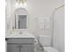 Stylish bathroom with a vanity, decorative mirror, and neutral color scheme at 503 Rose Fountain Dr., Myrtle Beach, SC 29579