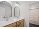 Bathroom features double sink vanity with framed mirrors and tile flooring at 503 Rose Fountain Dr., Myrtle Beach, SC 29579
