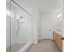Bright bathroom with a glass shower, double vanity, and modern fixtures and tile flooring at 503 Rose Fountain Dr., Myrtle Beach, SC 29579