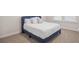 Cozy bedroom features plush carpet, neutral paint, and a comfortable queen bed at 503 Rose Fountain Dr., Myrtle Beach, SC 29579