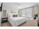 Well-lit bedroom with white furnishings, modern decor, and an abundance of natural light at 503 Rose Fountain Dr., Myrtle Beach, SC 29579