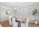Dining room featuring a wooden table, six chairs, and a decorative chandelier at 503 Rose Fountain Dr., Myrtle Beach, SC 29579