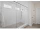 Modern walk-in shower with frameless glass, white subway tile, and rain shower head at 503 Rose Fountain Dr., Myrtle Beach, SC 29579