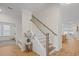 Bright staircase with white railings and wooden stairs leading to the second floor at 503 Rose Fountain Dr., Myrtle Beach, SC 29579