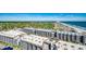 Breathtaking aerial view of oceanfront condominium with beach and mature trees at 5905 S Kings Hwy. # 1717, Myrtle Beach, SC 29575