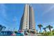 Tall condominium building featuring direct beach access, palm trees, and manicured landscaping at 5905 S Kings Hwy. # 1717, Myrtle Beach, SC 29575