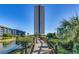 Exterior view of a condo complex with bridge access, landscaping, and water feature on a clear day at 5905 S Kings Hwy. # 1717, Myrtle Beach, SC 29575