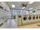 Well-maintained laundry room with modern washing machines and a large window offers convenience for residents at 5905 S Kings Hwy. # 1717, Myrtle Beach, SC 29575