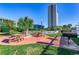Outdoor picnic area with tables, grills, and lush landscaping offers a perfect spot for community gatherings at 5905 S Kings Hwy. # 1717, Myrtle Beach, SC 29575