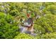 Aerial view of a home nestled among lush trees, highlighted with a location pin at 6001-1501 S Kings Hwy., Myrtle Beach, SC 29575