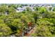 An aerial view with a location pin showing a home surrounded by trees in a neighborhood at 6001-1501 S Kings Hwy., Myrtle Beach, SC 29575