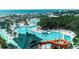 Aerial view of a resort featuring multiple pools, waterslides, and lush landscaping near the beach at 6001-1501 S Kings Hwy., Myrtle Beach, SC 29575