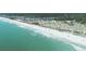 Sweeping aerial view of a pristine beach, turquoise water, and a charming coastal community at 6001-1501 S Kings Hwy., Myrtle Beach, SC 29575