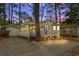 Charming single-story home with a cozy, illuminated porch set against a picturesque twilight sky at 6001-1501 S Kings Hwy., Myrtle Beach, SC 29575