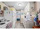 Bright kitchen featuring white appliances, cabinetry, and views into the adjacent bedroom at 6001-1501 S Kings Hwy., Myrtle Beach, SC 29575
