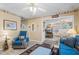 Cozy living room with a comfortable sofa and chair, seamlessly connected to the dining area at 6001-1501 S Kings Hwy., Myrtle Beach, SC 29575