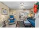 Cozy living room featuring a comfortable sofa and armchair, seamlessly flowing into the dining area at 6001-1501 S Kings Hwy., Myrtle Beach, SC 29575