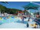 A vibrant pool scene with waterslides and people enjoying a sunny day at 6001-1501 S Kings Hwy., Myrtle Beach, SC 29575