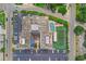 Aerial view of a building with a pool, tennis court, and parking lot, showcasing the amenities at 601 Mitchell Dr. # 806, Myrtle Beach, SC 29577