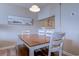 Dining room with hardwood floors, a wood table, and white chairs at 601 Mitchell Dr. # 806, Myrtle Beach, SC 29577
