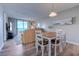 Living room featuring a dining table, chairs, and water view at 601 Mitchell Dr. # 806, Myrtle Beach, SC 29577