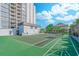 Community tennis court and shuffleboard court with apartment complex in the background at 601 Mitchell Dr. # 806, Myrtle Beach, SC 29577