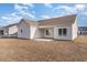 Spacious backyard with a covered patio and a well-maintained lawn, perfect for outdoor entertaining at 610 Lightwood Dr., Conway, SC 29526