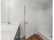 Bathroom featuring a white vanity with sink, framed mirror, and a shower with white tile at 610 Lightwood Dr., Conway, SC 29526