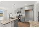 Modern kitchen with gray cabinets, granite countertops, stainless steel appliances, and a center island at 610 Lightwood Dr., Conway, SC 29526
