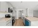 Modern kitchen featuring granite countertops, stainless steel appliances, gray cabinets, and an island with a sink at 610 Lightwood Dr., Conway, SC 29526
